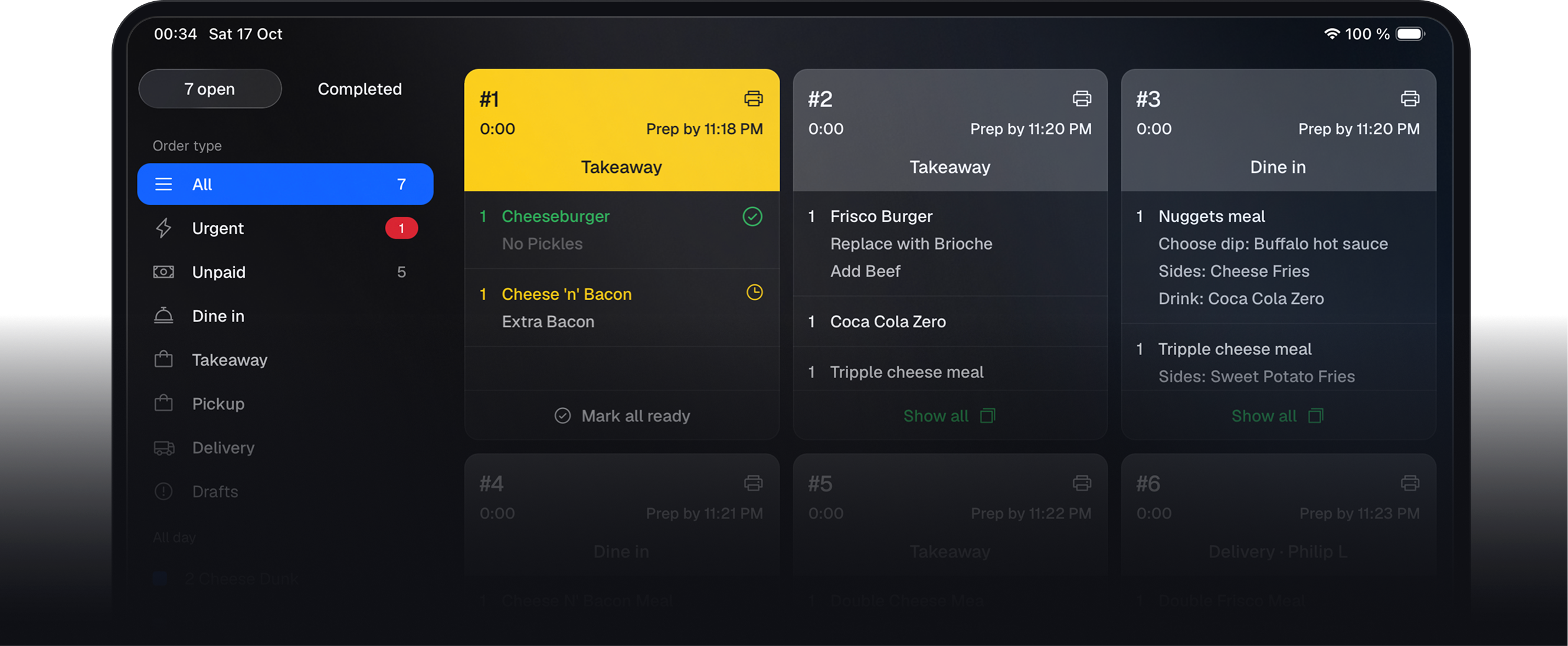 Kitchen display showing order tickets and preparation status